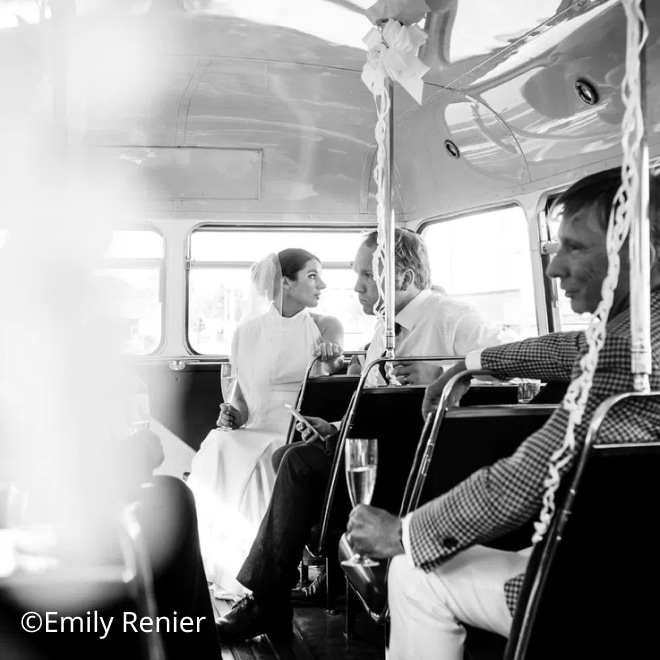 Photograph of a wedding couple on a vintage bus by Emily Renier